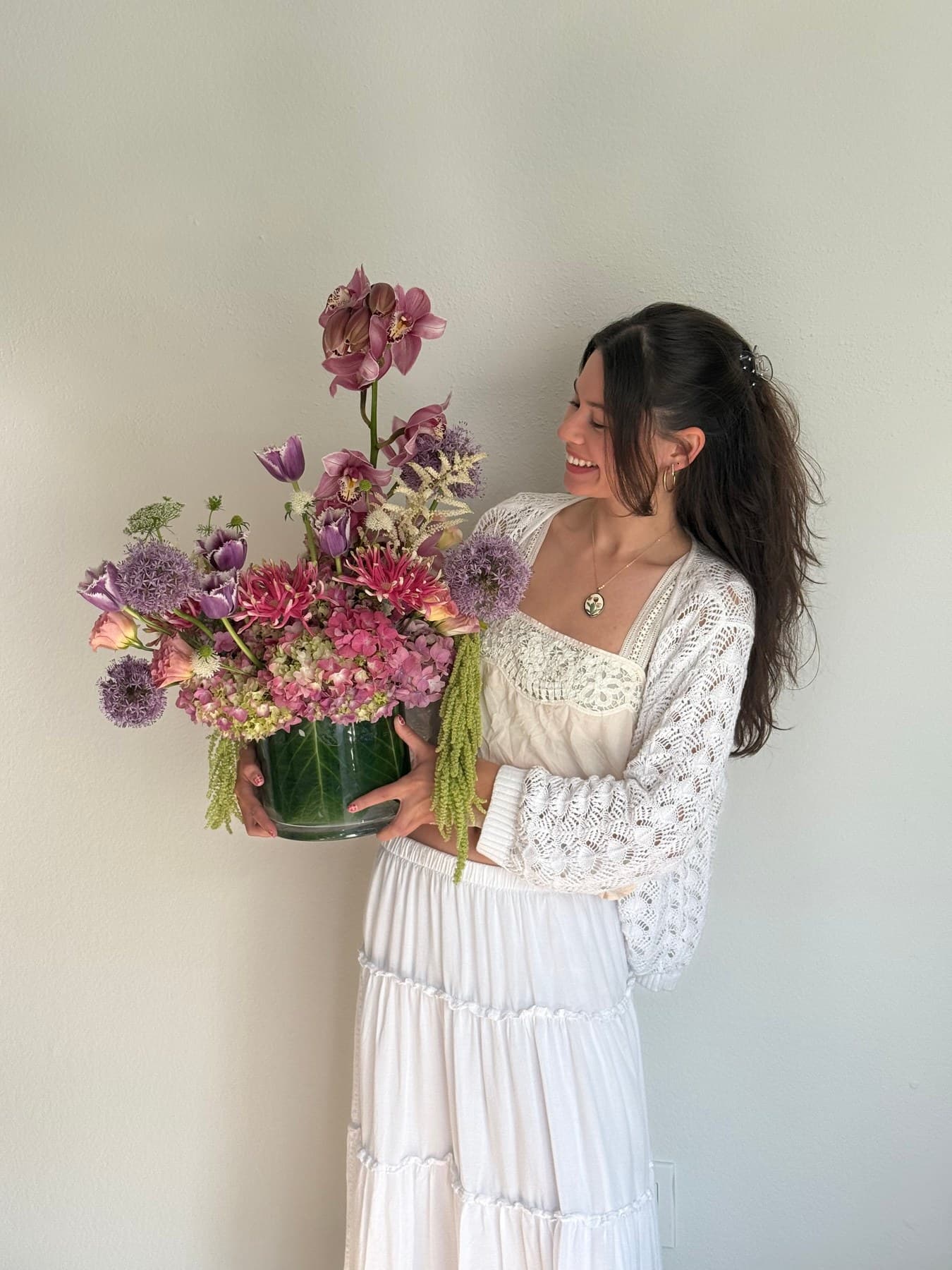 Aubrey holding Grandma's Orchid Garden for scale